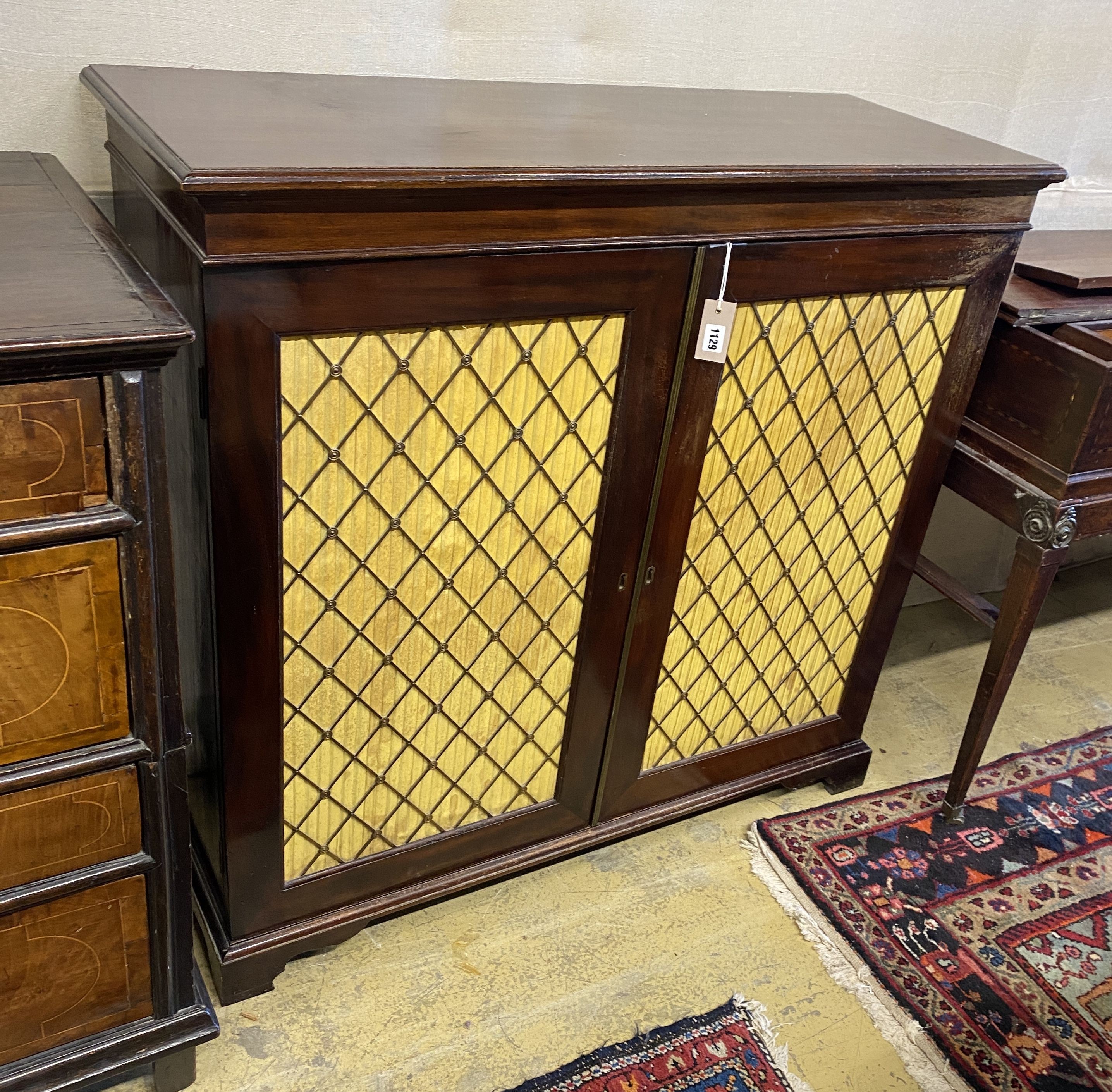 A mahogany chiffonier with two grill doors, width 109cm, depth 42cm, height 104cm